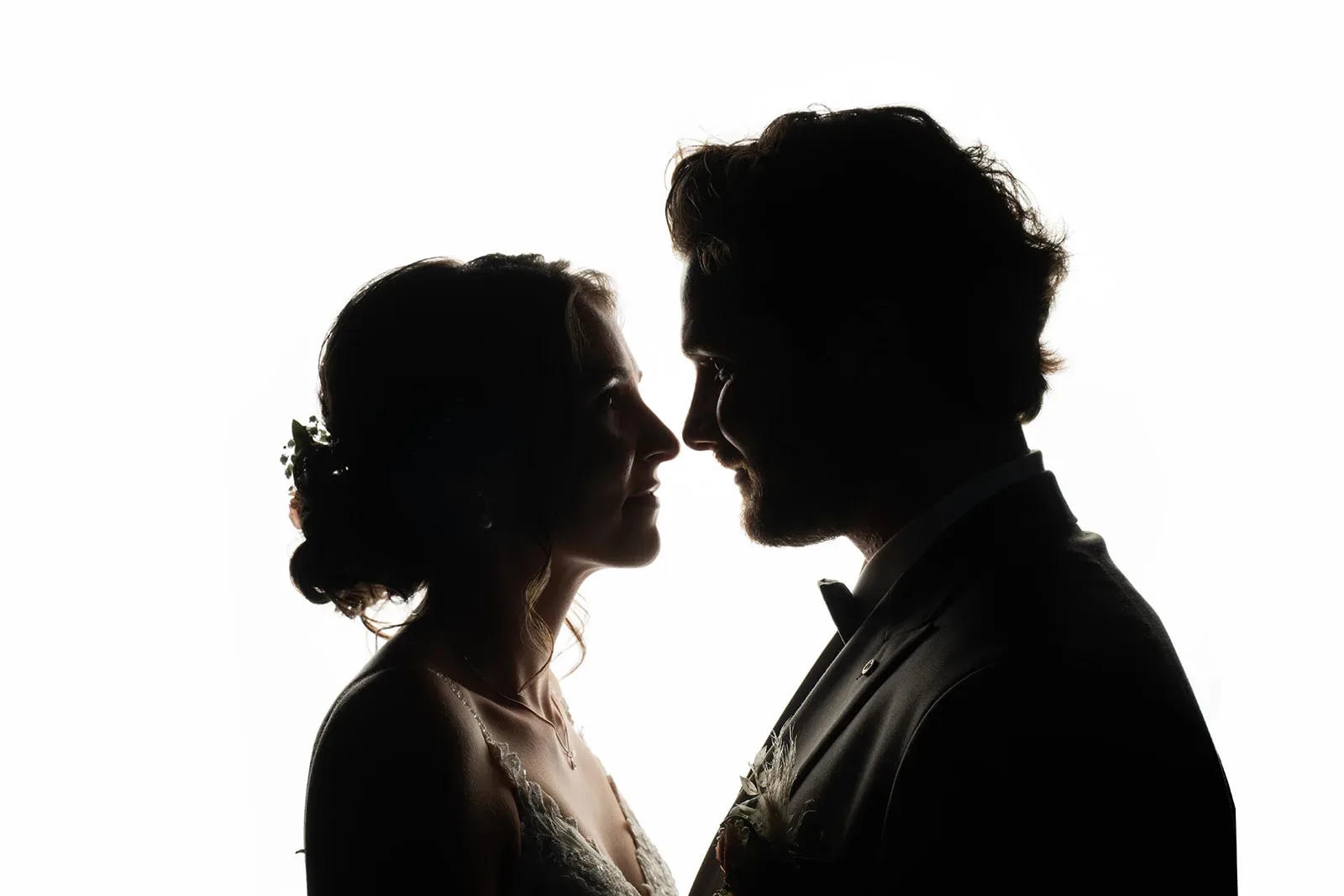 Wedding couple silhouette against a white background at Bächlihof