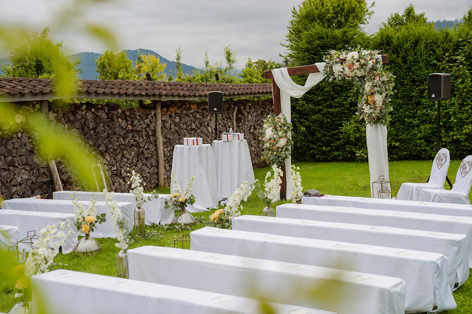 Outdoor wedding ceremony beside the garden pond at Bächlihof in Jona
